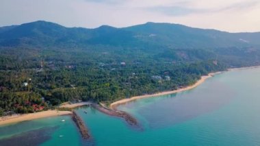 4k Drone Footage of the Beach at Mae Nam on Koh Samui in Thailand, Including Beachfront Resorts with Beautiful Clouds in the Sky and Crystal Teal Water