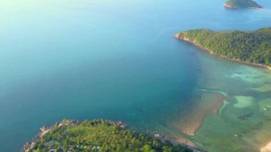 4k Aerial Drone Push Forward Shot of Salad Beach on Koh Phangan in Thailand with Fishing Boats, Teal Water, Coral, and Green Jungles