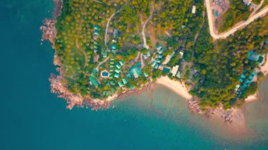 4k Aerial Drone Push Forward Shot of Salad Beach on Koh Phangan in Thailand with Fishing Boats, Teal Water, Coral, and Green Jungles