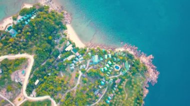 4k Aerial Drone Push Forward Shot of Salad Beach on Koh Phangan in Thailand with Fishing Boats, Teal Water, Coral, and Green Jungles