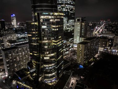 Amazingly beautiful City Business Center on the night with glittering lights from buildings, streets and traffic.  Illuminated skyscrapers and towers around 