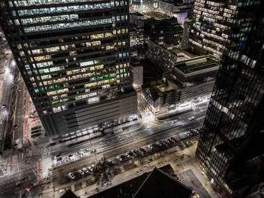 Office building still operate at very late night with many office worker doing part time work. Salary man overworking issue concept in urban of countries and urban night skyline.