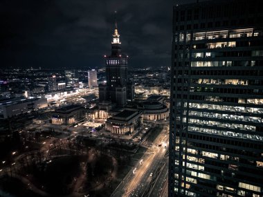 Office building still operate at very late night with many office worker doing part time work. Salary man overworking issue concept in urban of countries and urban night skyline.