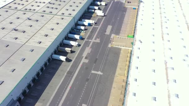 Aerial View Semi Trucks Cargo Trailers Standing Warehouses Ramps Loading — стоковое видео