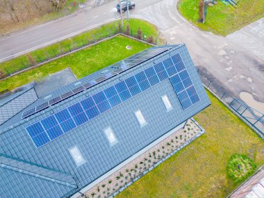 View of a residential building with solar panels on its roof
