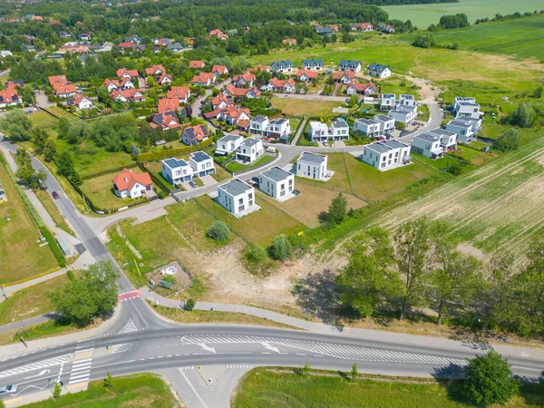 stock image Aerial of new construction luxury residential neighborhood street single family homes real estate