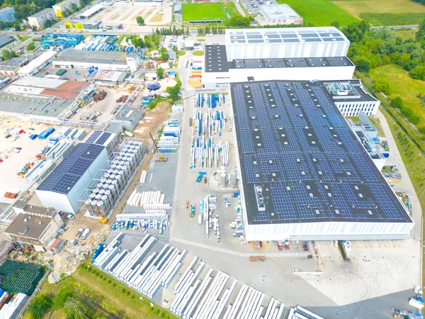 stock image Aerial view of modern storage warehouse with solar panels on the roof. Logistics center in industrial city zone from drone view. Background texture concept.