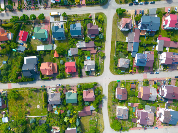 Aerial view of residential houses at spring. neighborhood, suburb. Real estate, drone shots, sunset, sunlight, from above.