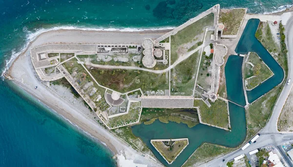 Aerial ground plan view of Rio (Rion) fortress near Patras Greece with pointed bastions, demi lunes, gun platforms incorporating an earlier Turkish castle, protecting the entrance to the Gulf of Corinth