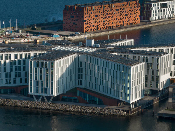 Modern Scandinavian design building in Nordhavn neighborhood in Copenhagen aerial view