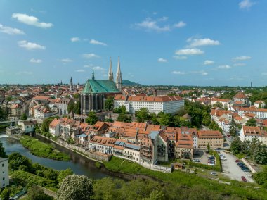 Aerial view of Gorlitz German-Polish border town separated by the Niesse river Pfarrkirche St. Peter und Paul Landmark Gothic evangelical church noted for its soaring twin spires, copper roof  clipart
