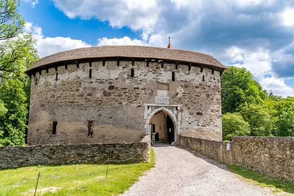 stock image Aerial view of Pernstejn castle with Gothic palace red roof, rectangular and round towers, barbican, forward gun platform in Moravia