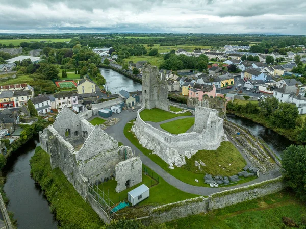 Aerial view of the Desmond castle in Askeaton Ireland in County Limerick on the river Deel, with Gothic Banqueting Hall, finest medieval secular building and remains of exquisite medieval fireplace