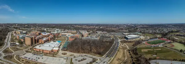 Aerial view of University of Maryland Baltimore County UMBC Catonsville admission office, pool, commons, quad, Honors college, admission office, retriever activities center, kuhn plaza, erickson field