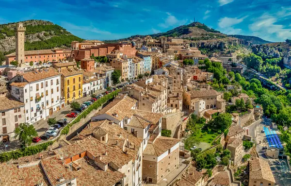 stock image Aerial view of Cuenca historic town center with in La Mancha Spain, colorful medieval houses with hanging balcony blue cloudy sky