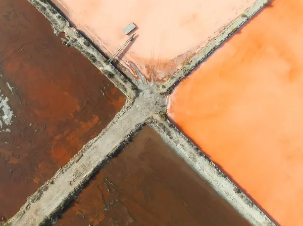 stock image Aerial view of La Manga salt mines, salt table, with vivid orange, red, pink colors palette ready for a painter to paint