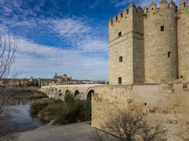 View of Calahorra tower a fortified gate in the historic center of Crdoba, Spain. The edifice is of Islamic origin guarding the Roman bridge clipart