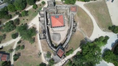 Drone flying over a tower of ancient Guimaraes Castle in Portugal, District of Braga, North region