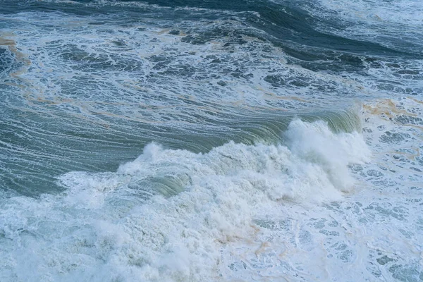 Overhead view of beautiful stormy ocean waves with white foam. Atlantic ocean