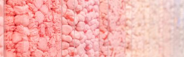 Pastel pink marshmallows in a shop window. Food texture. Selective focus