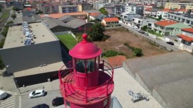  Aerial circle view over the red Regufe lighthouse in Povoa de Varzim. North Portugal