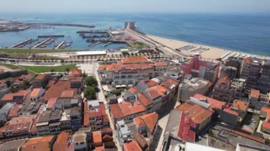 Aerial circle drone view of City of Povoa de Varzim on a bright sunny summer day, Porto region, Portugal. 