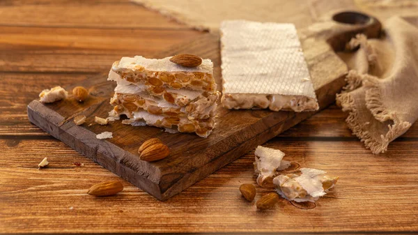 Heap Almond Spanish Turron Dessert Slices Nuts Wooden Desk — Foto Stock