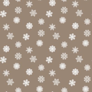 Ambalaj kağıdının renkli arka planında beyaz kar taneleri. Noel tatili kavramı.