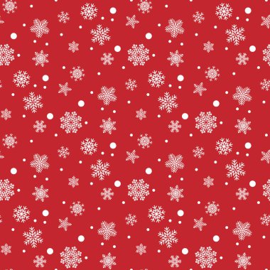 Ambalaj kağıdının renkli arka planında beyaz kar taneleri. Noel tatili kavramı.