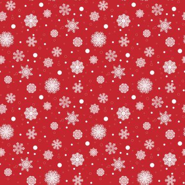 Ambalaj kağıdının renkli arka planında beyaz kar taneleri. Noel tatili kavramı.