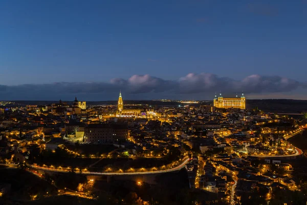 stock image Night photo of the city of Toledo in Spain. Toledo Cathedral and Alcazar de Toledo illuminated. Night photo of the streets and main monuments of Toledo in Spain. Historic buildings of Spain.