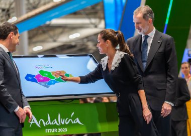 Madrid, Spain- January 18, 2023: The King and Queen of Spain and the president of the Andalusian Autonomous Community at FITUR. King Felipe VI and Queen Leticia inaugurate the FITUR fair in Madrid.