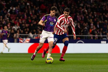 Madrid, Spain- January 21, 2023: Soccer match between Atletico de Madrid and Real Valladolid at Civitas Metropolitano. Alvaro Morata fights for a ball.