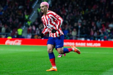 Madrid, Spain- January 21, 2023: Soccer match between Atletico de Madrid and Real Valladolid at Civitas Metropolitano. Antoine Griezman fights for the ball.