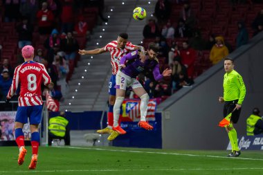 Madrid, Spain- January 21, 2023: Soccer match between Atletico de Madrid and Real Valladolid at Civitas Metropolitano. Reinildo Mandava fights for the ball.