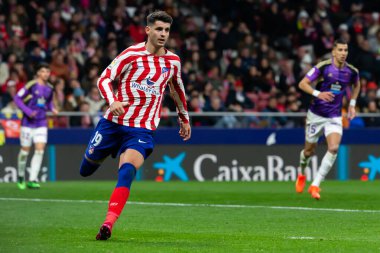 Madrid, Spain- January 21, 2023: Soccer match between Atletico de Madrid and Real Valladolid at Civitas Metropolitano. Alvaro Morata fights for a ball.