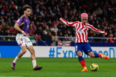 Madrid, Spain- January 21, 2023: Soccer match between Atletico de Madrid and Real Valladolid at Civitas Metropolitano. Antoine Griezman fights for the ball.