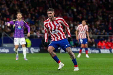Madrid, Spain- January 21, 2023: Soccer match between Atletico de Madrid and Real Valladolid at Civitas Metropolitano. Rodrigo De Paul fights for the ball on the field.