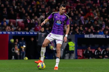 Madrid, Spain- January 21, 2023: Soccer match between Atletico de Madrid and Real Valladolid at Civitas Metropolitano. Jawad El Yamiq fights for the ball on the pitch.