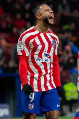Madrid, Spain- January 21, 2023: Soccer match between Atletico de Madrid and Real Valladolid at Civitas Metropolitano. Memphis Depay wails during the game.