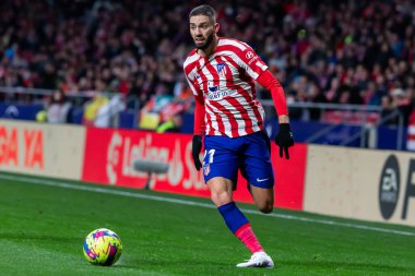 Madrid, Spain- January 21, 2023: Soccer match between Atletico de Madrid and Real Valladolid at Civitas Metropolitano. Yannick Carrasco fights for the ball on the field.