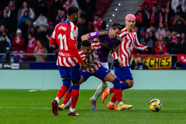 Madrid, Spain- January 21, 2023: Soccer match between Atletico de Madrid and Real Valladolid at Civitas Metropolitano. Antoine Griezman fights for the ball.
