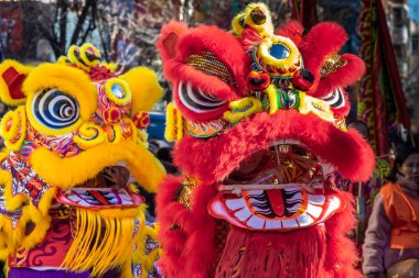 Madrid, Spain- January 21, 2023: Parade to celebrate the Chinese New Year through the streets of Madrid. Chinese citizens celebrate the year of the rabbit with typical costumes and oriental dances.
