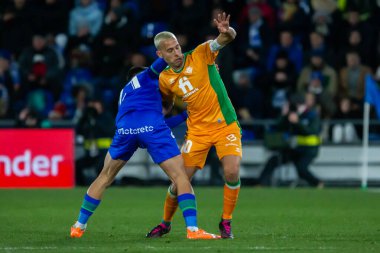 Madrid, Spain- January 28, 2023: Soccer match between Real Betis balonpie and Getafe F.C in Madrid. The Betis player Sergio Canales fights with an opponent for the ball.