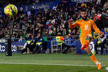 Madrid, Spain- January 28, 2023: Soccer match between Real Betis balonpie and Getafe F.C in Madrid. The Betis player Nabil Fekir fights with an opponent for the ball.