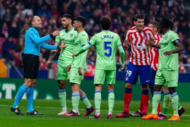 Madrid, Spain- February 4, 2023: League match between Atletico de Madrid and Getafe played in Madrid. The referee Mateu Lahoz signals a goal together with the players.