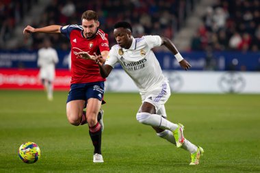 Madrid, Spain- February 18, 2023: League match between Real Madrid and Osasuna in Pamplona. Vinicius Jr. fighting for the ball. Football games. Real Madrid player.