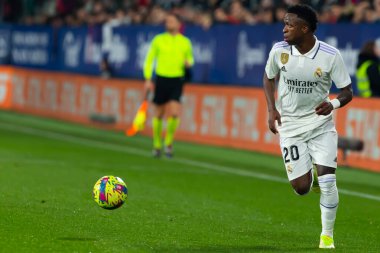 Madrid, Spain- February 18, 2023: League match between Real Madrid and Osasuna in Pamplona. Vinicius Jr. running with the ball. Football games. Real Madrid player.