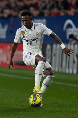 Madrid, Spain- February 18, 2023: League match between Real Madrid and Osasuna in Pamplona. Vinicius Jr. running with the ball. Football games. Real Madrid player.