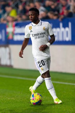 Madrid, Spain- February 18, 2023: League match between Real Madrid and Osasuna in Pamplona. Vinicius Jr. running with the ball. Football games. Real Madrid player.